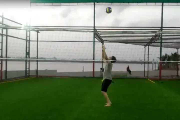 Mixed men and women volleyball team playing on a Huddle astro turf